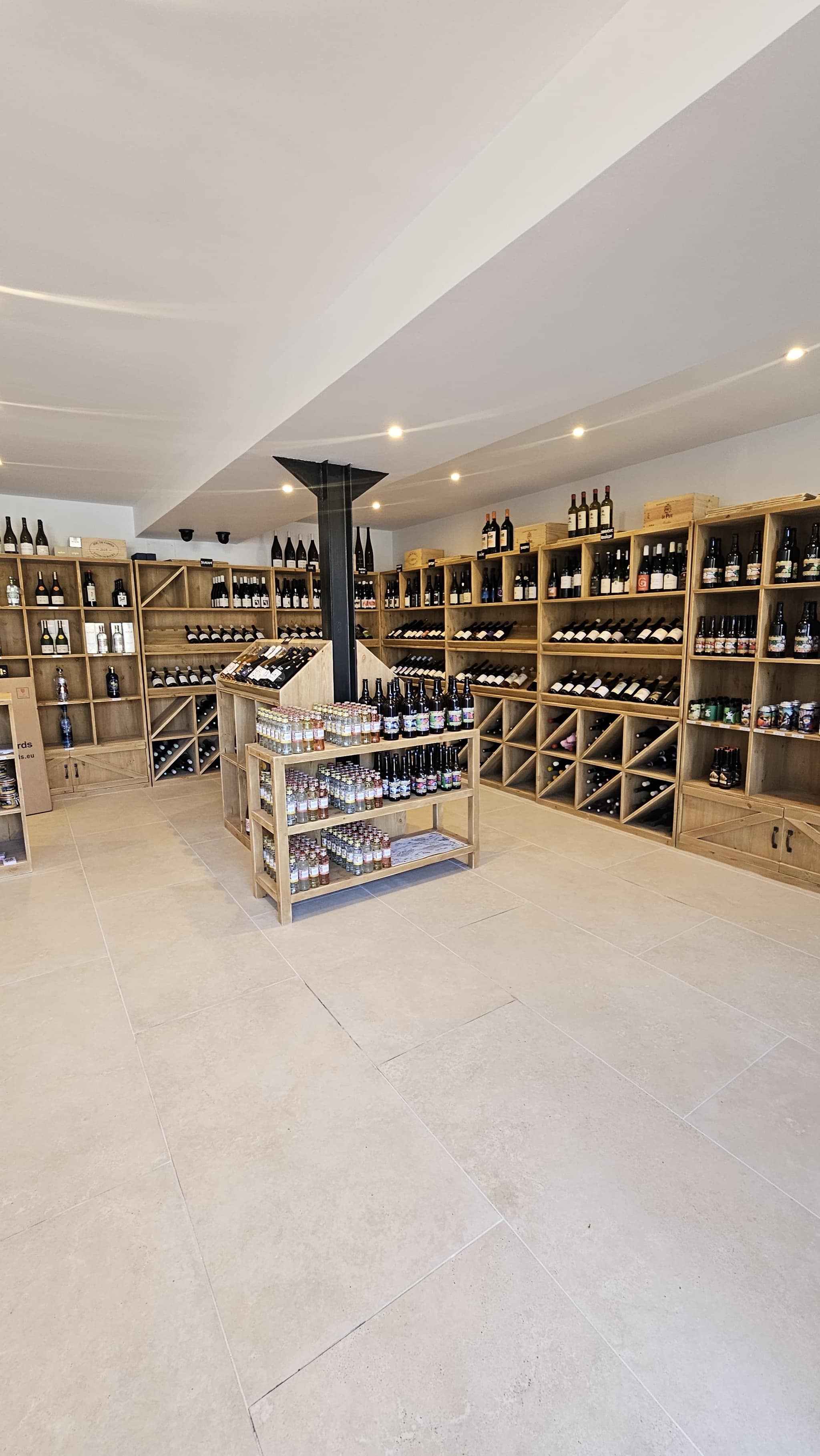 Wine selection and advice area inside L'Amicale du Raisin's Shop in Saint-Cyprien